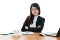 Happy Businesswoman Sitting At Office Desk