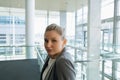 Happy Businesswoman standing in the corridor at office Royalty Free Stock Photo