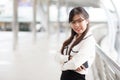 Happy businesswoman standing on sidewalk. Royalty Free Stock Photo