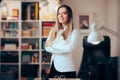 Happy Businesswoman Standing and Smiling in her Office wih Arms Crossed Royalty Free Stock Photo