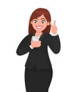 Happy businesswoman taking selfie and showing victory/peace/freedom sign while feeling exited. Social network, technology. Royalty Free Stock Photo