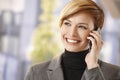 Happy businesswoman talking on mobile outdoors Royalty Free Stock Photo