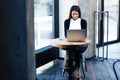 Happy businesswoman using laptop in cafe Royalty Free Stock Photo