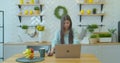 Happy businesswoman using laptop computer at home office in slow motion. Cheerful woman working laptop at table on Royalty Free Stock Photo