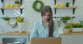 Happy businesswoman using laptop computer at home office in slow motion. Cheerful woman working laptop at table on Royalty Free Stock Photo