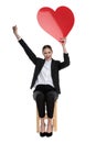 Businesswoman holding red heart and one fist up Royalty Free Stock Photo