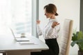 Happy businesswoman winner feels excited reading good news in em