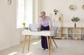 Happy businesswoman working on her laptop computer in a modern beautiful office interior Royalty Free Stock Photo