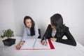 Happy businesswomen working at desk in office Royalty Free Stock Photo