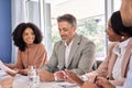 Happy busy diverse executive team having conversation during company meeting.