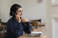 Happy busy pretty Indian business woman talking on mobile phone Royalty Free Stock Photo