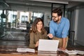 Happy busy professional business people discussing computer work in office. Royalty Free Stock Photo