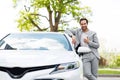 Happy buyer businessman enjoying new car, successful purchase and approves transport Royalty Free Stock Photo