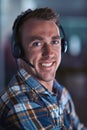 Happy call center agent smiling, ready to help a client on a phone call with good customer service and support. Close up Royalty Free Stock Photo