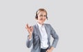 Happy call centre operator with headset showing okay gesture on light background, panorama Royalty Free Stock Photo