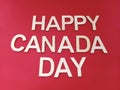 Happy Canada day sign on a red background