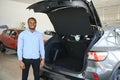 Happy Car Buyer, New Car Owner Concept. Portrait Of Excited Young African American Guy In Dealership Showroom Royalty Free Stock Photo