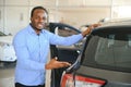 Happy Car Buyer, New Car Owner Concept. Portrait Of Excited Young African American Guy In Dealership Showroom Royalty Free Stock Photo