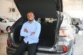 Happy Car Buyer, New Car Owner Concept. Portrait Of Excited Young African American Guy In Dealership Showroom Royalty Free Stock Photo