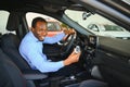 Happy Car Buyer, New Car Owner Concept. Portrait Of Excited Young African American Guy In Dealership Showroom Royalty Free Stock Photo