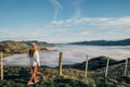 Happy carefree asian woman enjoying nature with layers of mountains and the mist in the morning at The peak of Bank Peninsula, Royalty Free Stock Photo