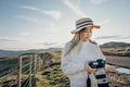 Happy carefree asian woman enjoying nature with layers of mountains and the mist in the morning at The peak of Bank Peninsula, Royalty Free Stock Photo