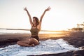 Happy carefree beautiful woman enjoying sunset evening on the sandy beach, having fun, smiling Royalty Free Stock Photo