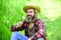 Happy and carefree life. Peace of mind. Rest and relax. Make wish. Peaceful man in straw summer hat. Bearded man blowing