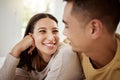 Happy, carefree and smiling couple relaxing together at home and spending quality time. Relaxed, loving and excited Royalty Free Stock Photo