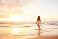 Happy Carefree Woman on the Beach at Sunset