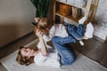 a happy and caring young mother plays with her little daughter. happily spend time with your child Royalty Free Stock Photo