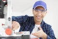 happy carpenter working on electric buzz saw Royalty Free Stock Photo