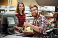 Happy cashier man on workspace in supermarket Royalty Free Stock Photo