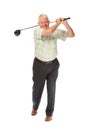 Happy casual mature golfer swinging a club