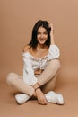 Happy casual woman lying on the floor over pastel background. Lady, cute. Provence concept. High quality photo