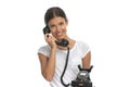 Happy casual woman talking on old telephone and smiling Royalty Free Stock Photo