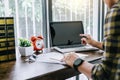 Happy casual young asian man working in home or small office wit Royalty Free Stock Photo