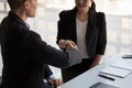 Happy caucasia male and asian female hand shaking, successful businessman handshake after good deal for both companies Royalty Free Stock Photo