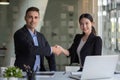 Happy caucasia male and asian female hand shaking, successful businessman handshake after good deal for both companies Royalty Free Stock Photo