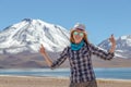 Happy woman with thumbs up enjoy solo trip and admire unique epic landscape of the Moon Valley, Chile Royalty Free Stock Photo