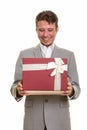 Happy Caucasian businessman opening gift box ready for Valentine Royalty Free Stock Photo