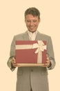 Happy Caucasian businessman opening gift box ready for Valentine's day Royalty Free Stock Photo