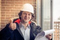 Happy Caucasian Construction Worker Giving Thumb Up. Soft focus, toned. Royalty Free Stock Photo
