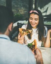 Happy caucasian couple eating pizza and drinking red wine Royalty Free Stock Photo