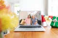 Happy caucasian couple having christmas laptop video call on table Royalty Free Stock Photo