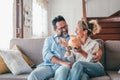 Happy caucasian couple holding piggy bank to save money to make their future dreams come true. Loving man and woman holding piggy Royalty Free Stock Photo