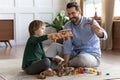 Happy Caucasian dad and son play at home Royalty Free Stock Photo