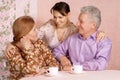 Happy Caucasian elderly parents with a daughter