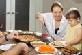 Happy caucasian family eating homemade food