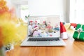 Happy caucasian family with santa hats and christmas decorations having christmas laptop video call Royalty Free Stock Photo